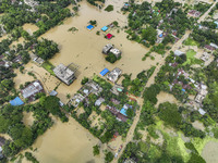 An aerial view shows flooded villages in the Mohipal area of Feni district in Chittagong division, Bangladesh, on August 23, 2024. At least...