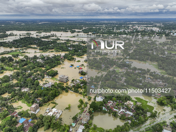 An aerial view shows flooded villages in the Mohipal area of Feni district in Chittagong division, Bangladesh, on August 23, 2024. At least...