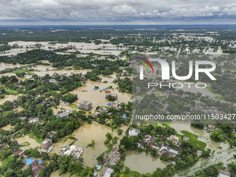 An aerial view shows flooded villages in the Mohipal area of Feni district in Chittagong division, Bangladesh, on August 23, 2024. At least...