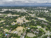 An aerial view shows flooded villages in the Mohipal area of Feni district in Chittagong division, Bangladesh, on August 23, 2024. At least...