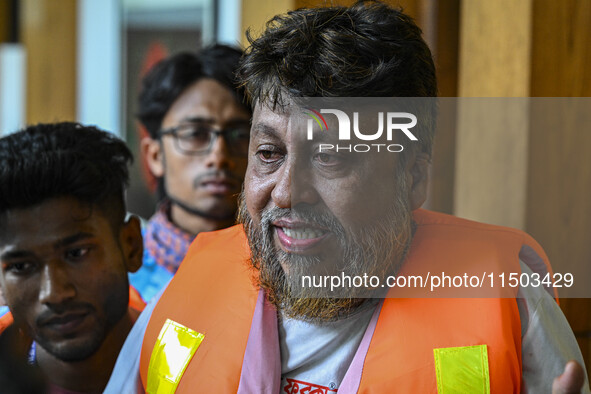 A relative shows a fearful face as they cannot contact their relative. Flood-affected residents in the Mohipal area of the Feni district in...