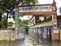 Flood-affected people take temporary shelter at a school building in the Mohipal area of Feni district in Chittagong division, Bangladesh, o...