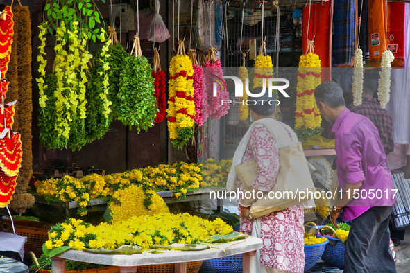 Flowers and floral garlands are for sale at the Chalai market in Thiruvananthapuram, Kerala, India, on April 13, 2024. The Chalai Market (Ch...