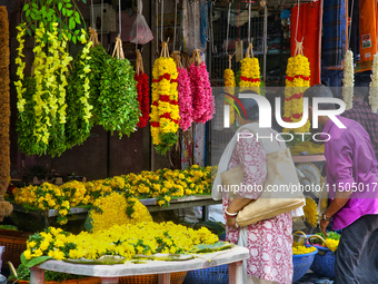 Flowers and floral garlands are for sale at the Chalai market in Thiruvananthapuram, Kerala, India, on April 13, 2024. The Chalai Market (Ch...