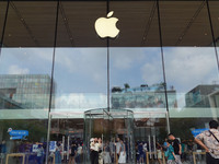 People experience products at the Apple flagship store at Taikoo Li in Sanlitun, a trendy fashion district in Beijing, China, on August 18,...