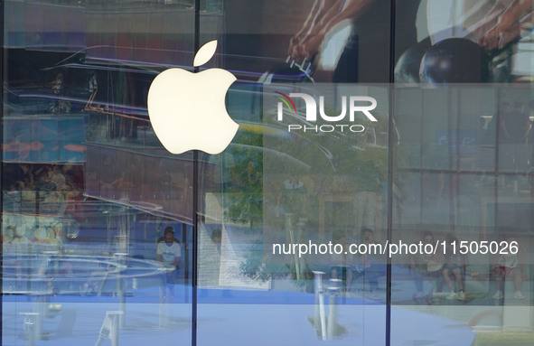 People experience products at the Apple flagship store at Taikoo Li in Sanlitun, a trendy fashion district in Beijing, China, on August 18,...