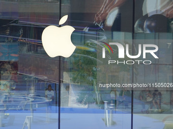 People experience products at the Apple flagship store at Taikoo Li in Sanlitun, a trendy fashion district in Beijing, China, on August 18,...