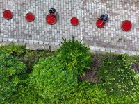 Villagers dry chili peppers and corn in Miaoluo village in Qiandongnan Miao and Dong autonomous Prefecture in Qiandongnan, China, on August...