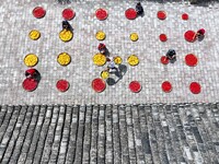 Villagers dry chili peppers and corn in Miaoluo village in Qiandongnan Miao and Dong autonomous Prefecture in Qiandongnan, China, on August...