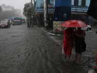 Vehicles drive through a flooded street during the heavy monsoon rain in Kolkata, India, on August 24, 2024. (