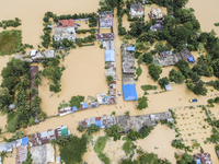 An aerial view of a flooded village in the Bishumier Hat area of Mirsarai Upazila, Chittagong Division, Bangladesh, on August 24, 2024. At l...