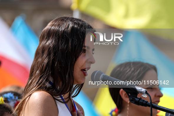 Members of Ukrainian diaspora chant slogans and hold Ukrainian flags during a demonstration on Ukrainian Independence Day  on the Main Squar...