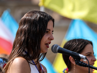 Members of Ukrainian diaspora chant slogans and hold Ukrainian flags during a demonstration on Ukrainian Independence Day  on the Main Squar...