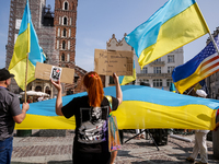 Members of Ukrainian diaspora chant slogans and hold Ukrainian flags during a demonstration on Ukrainian Independence Day  on the Main Squar...