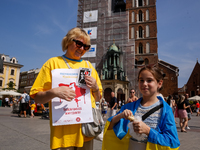 Members of Ukrainian diaspora chant slogans and hold Ukrainian flags during a demonstration on Ukrainian Independence Day  on the Main Squar...