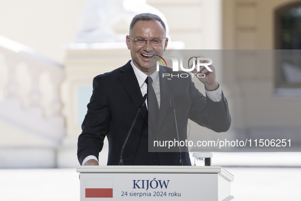 Polish President Andrzej Duda reacts during a joint press conference with Ukrainian President Volodymyr Zelenskiy and Lithuanian Prime Minis...