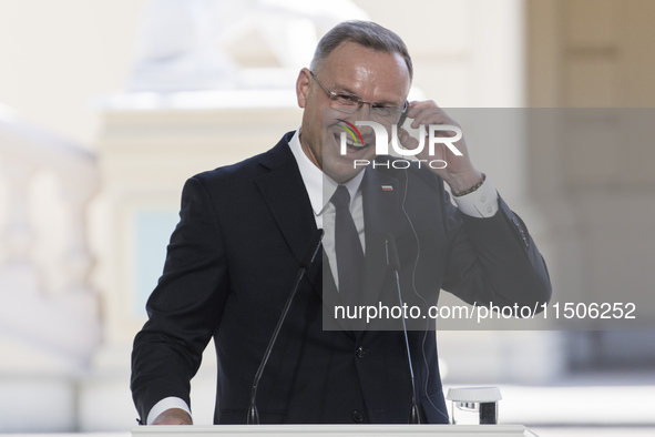 Polish President Andrzej Duda reacts during a joint press conference with Ukrainian President Volodymyr Zelenskiy and Lithuanian Prime Minis...