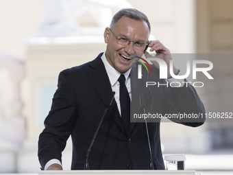 Polish President Andrzej Duda reacts during a joint press conference with Ukrainian President Volodymyr Zelenskiy and Lithuanian Prime Minis...