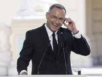 Polish President Andrzej Duda reacts during a joint press conference with Ukrainian President Volodymyr Zelenskiy and Lithuanian Prime Minis...