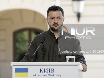 Ukrainian President Volodymyr Zelenskiy speaks during a joint press conference with Polish President Andrzej Duda and Lithuanian Prime Minis...