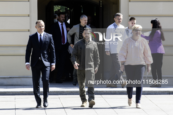 Ukraine's President Volodymyr Zelenskiy, Polish President Andrzej Duda, and Lithuanian Prime Minister Ingrida Simonyte arrive for a joint pr...