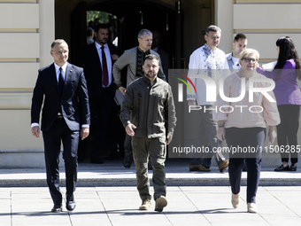 Ukraine's President Volodymyr Zelenskiy, Polish President Andrzej Duda, and Lithuanian Prime Minister Ingrida Simonyte arrive for a joint pr...