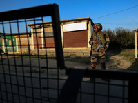 Indian Army soldiers stand alert after an encounter breaks out between militants and security forces in which one militant is killed in Wate...