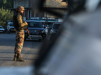 Indian Army soldiers stand alert after an encounter breaks out between militants and security forces in which one militant is killed in Wate...