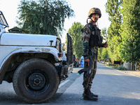 Indian Army soldiers stand alert after an encounter breaks out between militants and security forces in which one militant is killed in Wate...