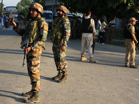 Indian Army soldiers stand alert after an encounter breaks out between militants and security forces in which one militant is killed in Wate...