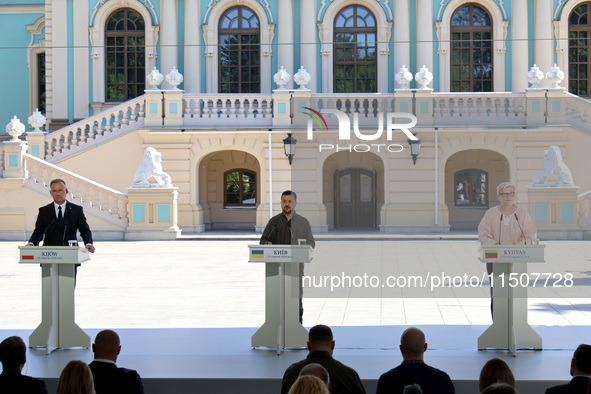 President of Poland Andrzej Duda, President of Ukraine Volodymyr Zelenskyy, and Prime Minister of Lithuania Ingrida Simonyte (L to R) hold a...