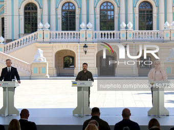 President of Poland Andrzej Duda, President of Ukraine Volodymyr Zelenskyy, and Prime Minister of Lithuania Ingrida Simonyte (L to R) hold a...