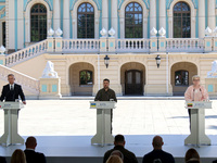 President of Poland Andrzej Duda, President of Ukraine Volodymyr Zelenskyy, and Prime Minister of Lithuania Ingrida Simonyte (L to R) hold a...