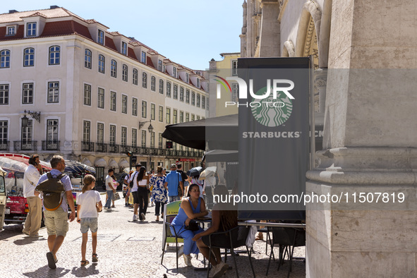 A general view of people having coffee at a Starbucks Coffee store in Lisbon, Portugal, on August 24, 2024. Brian Niccol, CEO of Starbucks s...