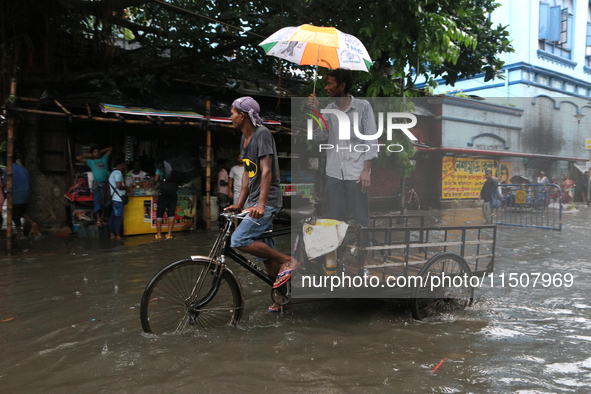 A street floods during the heavy monsoon rain in Kolkata, India, on August 24, 2024. 