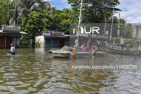 Volunteers help local people transport from one place to another in Feni district in Chittagong division, Bangladesh, on August 24, 2024. 