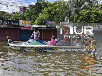 Volunteers help local people transport from one place to another in Feni district in Chittagong division, Bangladesh, on August 24, 2024. (