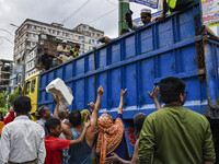 Local people want relief from volunteers in Feni district in Chittagong division, Bangladesh, on August 24, 2024. (