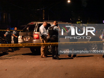 An unidentified male is shot and killed on the 2400 block of S. Christiana Avenue in Chicago, Illinois, United States, on August 24, 2024. A...