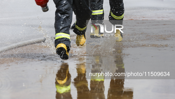 Firefighters participate in a rescue drill at a chemical company in Huai'an, Jiangsu province, China, on August 25, 2024. 