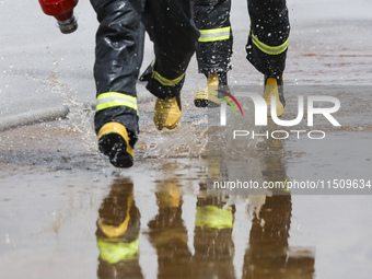 Firefighters participate in a rescue drill at a chemical company in Huai'an, Jiangsu province, China, on August 25, 2024. (