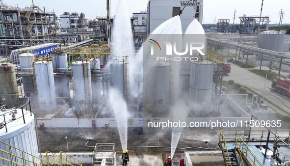 Firefighters participate in a rescue drill at a chemical company in Huai'an, Jiangsu province, China, on August 25, 2024. 