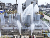 Firefighters participate in a rescue drill at a chemical company in Huai'an, Jiangsu province, China, on August 25, 2024. (