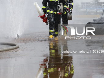 Firefighters participate in a rescue drill at a chemical company in Huai'an, Jiangsu province, China, on August 25, 2024. (