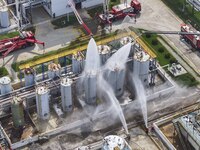 Firefighters participate in a rescue drill at a chemical company in Huai'an, Jiangsu province, China, on August 25, 2024. (