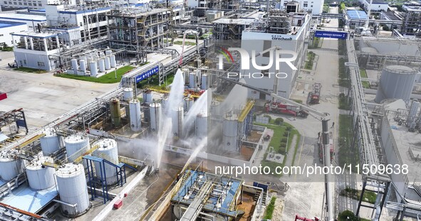 Firefighters participate in a rescue drill at a chemical company in Huai'an, Jiangsu province, China, on August 25, 2024. 