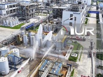 Firefighters participate in a rescue drill at a chemical company in Huai'an, Jiangsu province, China, on August 25, 2024. (