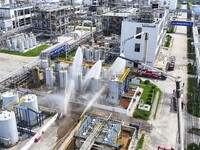 Firefighters participate in a rescue drill at a chemical company in Huai'an, Jiangsu province, China, on August 25, 2024. (