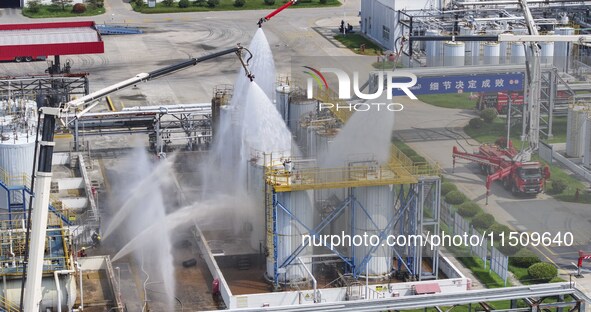 Firefighters participate in a rescue drill at a chemical company in Huai'an, Jiangsu province, China, on August 25, 2024. 