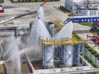 Firefighters participate in a rescue drill at a chemical company in Huai'an, Jiangsu province, China, on August 25, 2024. (